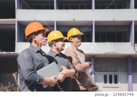 Demolition control supervisor and contractor on demolish building. Earthquake, industry. Demolition control supervisor and contractor on demolish building. Earthquake, industry. 124692749