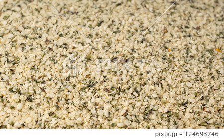 Shelled hemp seeds pile, peeled cannabis grains, marijuana kernels without peel Shelled hemp seeds pile, peeled cannabis grains, marijuana kernels without peel 124693746