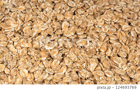 Spelt flakes isolated, dry raw rolled flat oat grains, wheat, oatmeal or bran, barley rye cereals Spelt flakes isolated, dry raw rolled flat oat grains, wheat, oatmeal or bran, barley rye cereals 124693769
