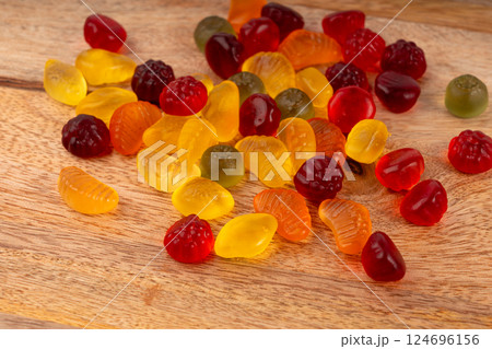 Fruit gummy candy pile, vegan chewing marmalade pills, jelly gumdrops heap Fruit gummy candy pile, vegan chewing marmalade pills, jelly gumdrops heap 124696156