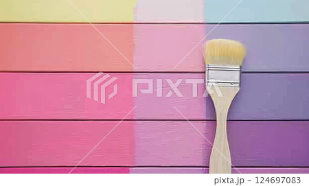Colorful Creative Background Paintbrush Resting on a Vibrant Multicolored Wooden Surface 124697083