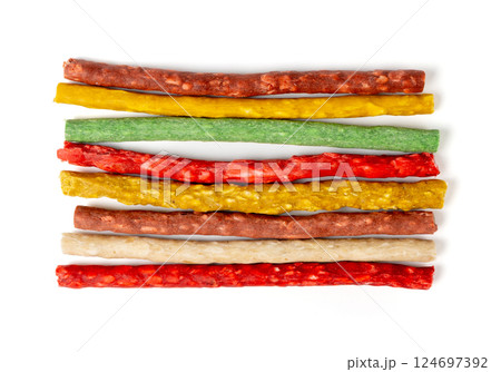 Rawhide chew sticks for dogs, colorful collagen dog food, pressed dry kibble, dental care treats Rawhide chew sticks for dogs, colorful collagen dog food, pressed dry kibble, dental care treats 124697392
