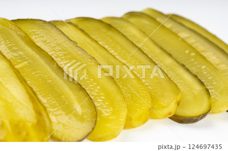 Pickled sliced cucumbers, fermented food, marinated canned vegetables, gherkins, pickles Pickled sliced cucumbers, fermented food, marinated canned vegetables, gherkins, pickles 124697435