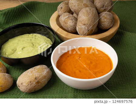 Red mojo rojo and green mojo verde sauces, traditional Tenerife dips, mojo picon dressing Red mojo rojo and green mojo verde sauces, traditional Tenerife dips, mojo picon dressing 124697576