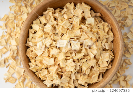 Dry parsley root, dried diced celery cubes, scattered small liquorice pileces, dry vegetable Dry parsley root, dried diced celery cubes, scattered small liquorice pileces, dry vegetable 124697586