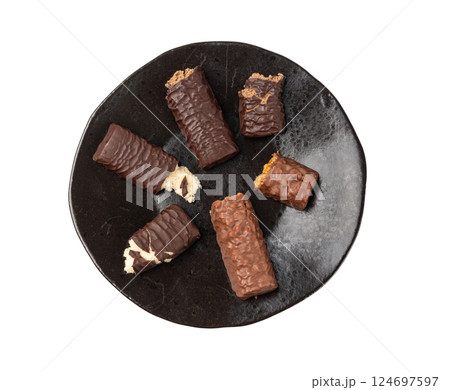 Protein bar isolated, chocolate energy paleo snack, healthy cereal nutrition with nuts, fruits, muesli Protein bar isolated, chocolate energy paleo snack, healthy cereal nutrition with nuts, fruits, muesli 124697597