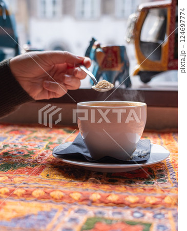 Masala chai an Indian restaurant, spiced milk tea, traditional cardamom hot drink with spices Masala chai an Indian restaurant, spiced milk tea, traditional cardamom hot drink with spices 124697774