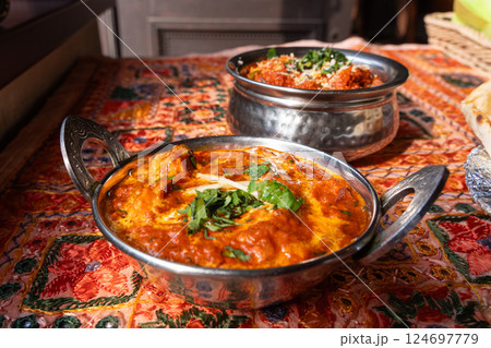 Butter paneer masala. Cottage cheese curry, hot spicy chicken korma, traditional indian food 124697779