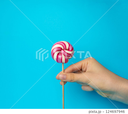 Color lollipop, spiral candy on stick, colorful striped lollypop, round fruit caramel, circle lollipop 124697946