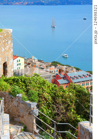 Yachts, boats in bay of Porto Venere, Liguria. Sea and tourism in Italy. Traditional buildings. Background for design. Yachts, boats in bay of Porto Venere, Liguria. Sea and tourism in Italy. Traditional buildings. Background for design. 124698321