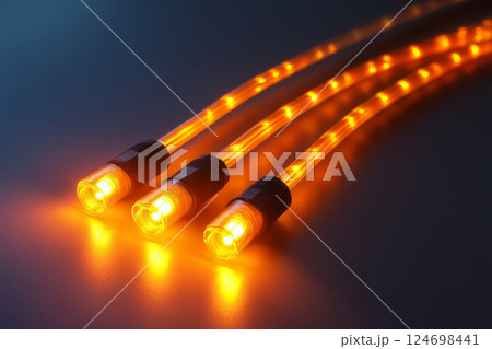 Glowing fiber optic cables with LED lights 124698441