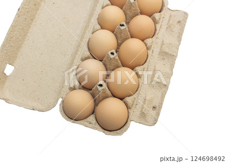 Light brown organic raw chicken eggs in package isolated on white background. 124698492