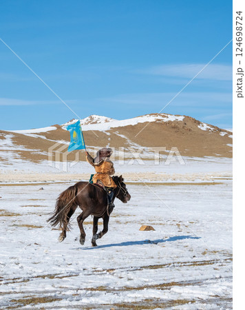 boy with the Flag of Kazakhstan in his hand ride a horse boy with the Flag of Kazakhstan in his hand ride a horse 124698724