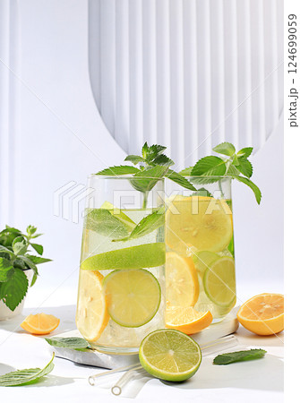 Diet vegan cocktail with citrus, detox water, mojito with lemon, lime, orange, mint and green apple. Detox diet and weight loss concept, healthy lifestyle advertising, menu for cafe and restaurant. 124699059