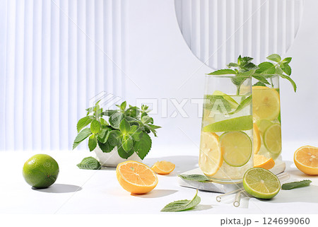 Detox drink with lemon, mint, lime and green apple on a light table, mojito or cocktail improves metabolism, promotes weight loss and strengthens immunity, healthy lifestyle concept, selective focus. 124699060