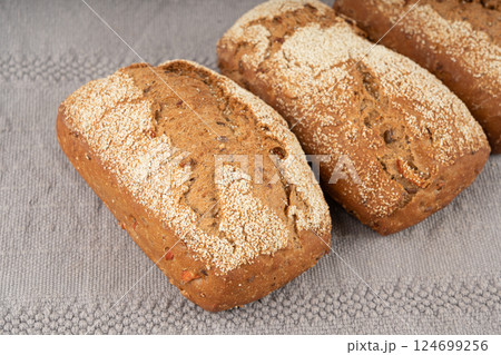 Whole wheat brown bread, fitness pumpkin carrot buns with seeds, cereal bread grain bun 124699256
