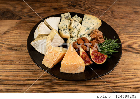 Cheese plate of color cheeses variety, yellow, white and blue cheese board, assorted dairy products 124699285