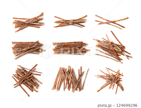 Fish Jerky Isolated, Dry Salted Seafood Snack, Hake Stockfish, Small Pieces of Dehydrated Pollock Fish Jerky Isolated, Dry Salted Seafood Snack, Hake Stockfish, Small Pieces of Dehydrated Pollock 124699296