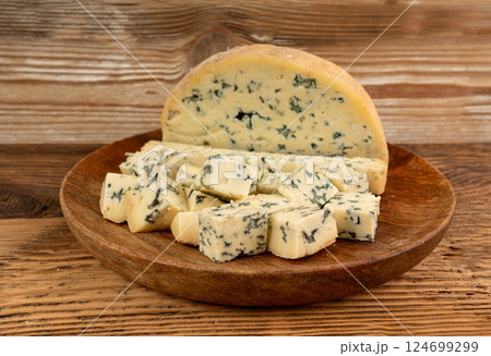 Fourme cheese, stinky french cheese, Fourme d'Ambert gourmet food, semi-hard blue cheese 124699299