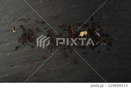 Flavored Black Tea Leaves Pile Texture, High Quality Black Tea Pile with Fruits and Flowers, Dry Tea Leaves Flavored Black Tea Leaves Pile Texture, High Quality Black Tea Pile with Fruits and Flowers, Dry Tea Leaves 124699313