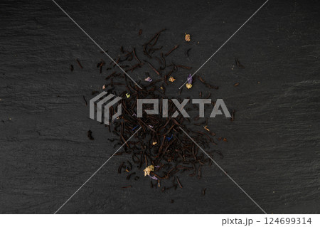 Flavored Black Tea Leaves Pile Texture, High Quality Black Tea Pile with Fruits and Flowers, Dry Tea Leaves 124699314