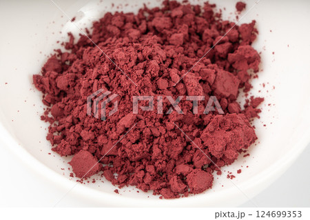 Acai powder circle pile, violet superfood dust, pink fruit flour extract mound 124699353