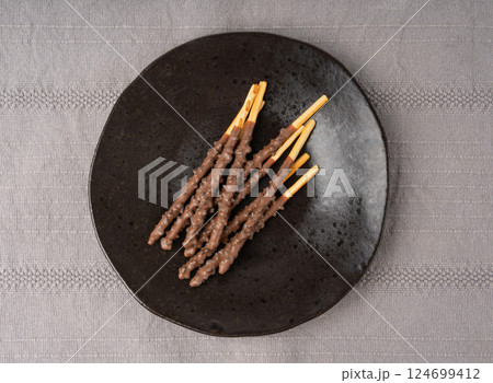 Chocolate cookie sticks, long choco pastries, japan biscuit tubes, korea cracker sticks Chocolate cookie sticks, long choco pastries, japan biscuit tubes, korea cracker sticks 124699412