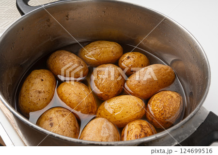 Papas arrugadas sea water boiled potatoes, whole prepared unpeeled vegetables, cooked potato 124699516