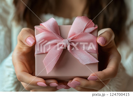 Woman hands holding craft gift satin ribbon, shopping Valentines, New Year, Mothers, Christmas 124700415