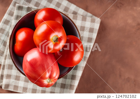 Fresh Red Tomatoes in Bowl on Checkered Napkin, Copy Space Fresh Red Tomatoes in Bowl on Checkered Napkin, Copy Space 124702102