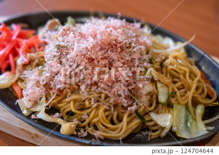 Yakisoba with dried bonito flakes, a Japanese noodle stir-fried dish 124704644