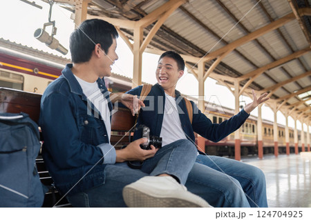 Travel and Connection. Engaging conversation between two friends while waiting for their train. 124704925
