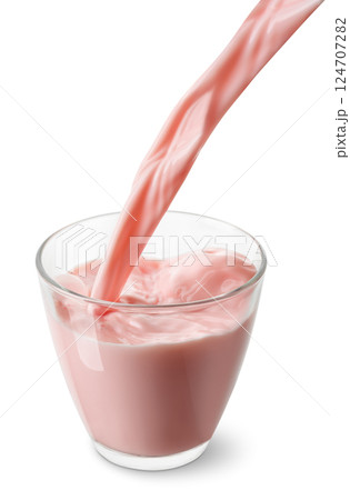 strawberry or cherry milk pouring into glass isolated on white background 124707282