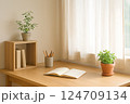 窓辺に置いた本と観葉植物 124709134