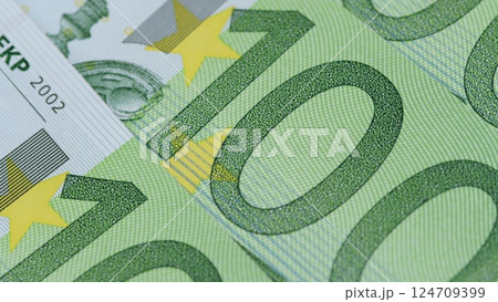 CloseUp View of Euro Banknotes, Highlighting Their Unique Design and Intricate Details CloseUp View of Euro Banknotes, Highlighting Their Unique Design and Intricate Details 124709399