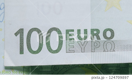 CloseUp Image of a 100 Euro Banknote with Intricate Designs and Security Features CloseUp Image of a 100 Euro Banknote with Intricate Designs and Security Features 124709897