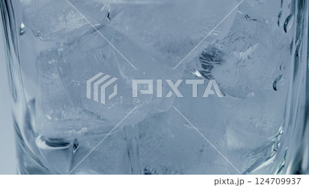 Refreshing Ice Cubes in a Clear Glass that Sparkle with Chill and Elegance Perfect for Any Occasion Refreshing Ice Cubes in a Clear Glass that Sparkle with Chill and Elegance Perfect for Any Occasion 124709937