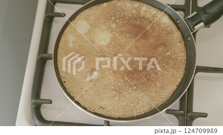 Enjoy the experience of cooking delicious crepes in a frying pan right on the stove Enjoy the experience of cooking delicious crepes in a frying pan right on the stove 124709989