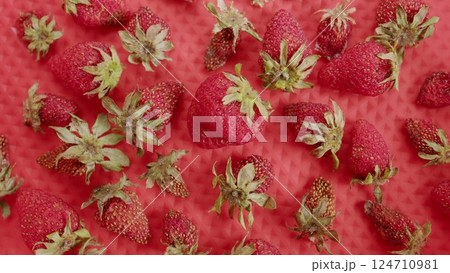 Fresh Strawberries on a Vibrant, Colorful Background Ready for Photography and Enjoyment 124710981