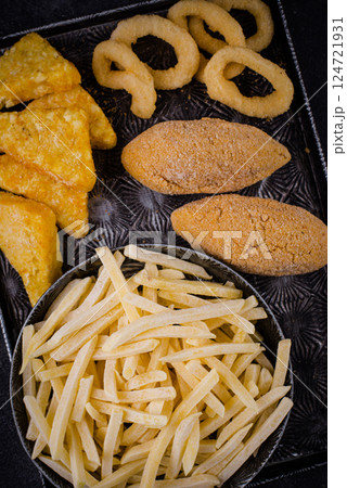 Frozen food assortment. Potato hashbrowns and french fries Frozen food assortment. Potato hashbrowns and french fries 124721931