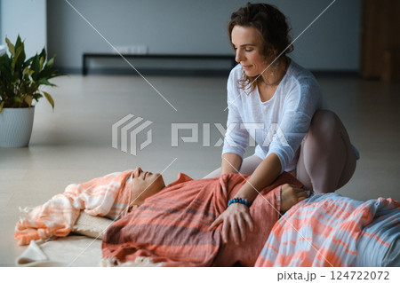 Relaxation and healing through gentle massage in a serene indoor setting during a wellness session Relaxation and healing through gentle massage in a serene indoor setting during a wellness session 124722072