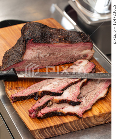 Sliced american beef brisket on a wooden board 124723015