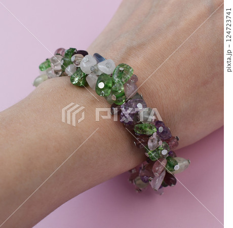 Unique bracelet for women on a pink background, promotional photo for an online vintage and handmade jewelry store Unique bracelet for women on a pink background, promotional photo for an online vintage and handmade jewelry store 124723741