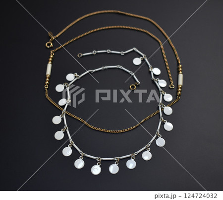Unique necklace for women on a black background, promotional photo for an online vintage and handmade jewelry store 124724032
