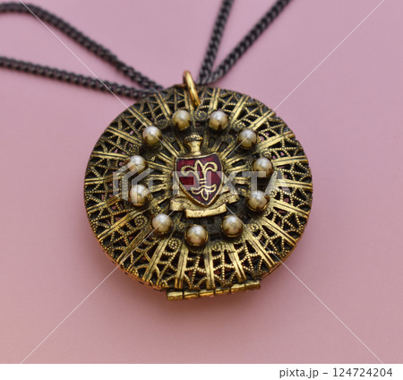 Unique necklace for women on a pink background, promotional photo for an online vintage and handmade jewelry store Unique necklace for women on a pink background, promotional photo for an online vintage and handmade jewelry store 124724204