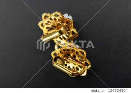 Unique earrings for women on a black background, promotional photo for an online vintage and handmade jewelry store Unique earrings for women on a black background, promotional photo for an online vintage and handmade jewelry store 124724504