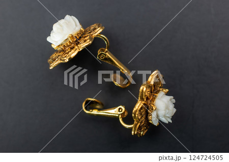 Unique earrings for women on a black background, promotional photo for an online vintage and handmade jewelry store Unique earrings for women on a black background, promotional photo for an online vintage and handmade jewelry store 124724505