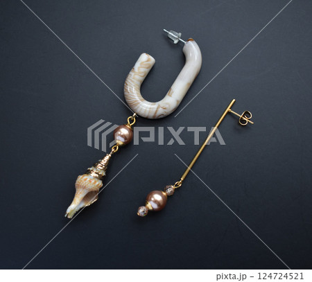 Unique earrings for women on a black background, promotional photo for an online vintage and handmade jewelry store 124724521