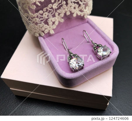 Unique earrings for women on a black background, promotional photo for an online vintage and handmade jewelry store 124724606
