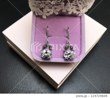 Unique earrings for women on a black background, promotional photo for an online vintage and handmade jewelry store Unique earrings for women on a black background, promotional photo for an online vintage and handmade jewelry store 124724609
